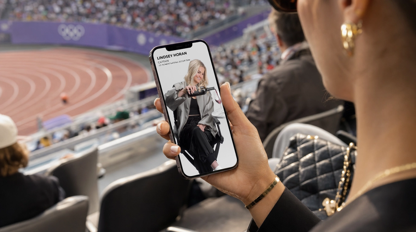 In the stands of an Olympic stadium, a fan holds a phone showing Lindsey Horan, captain of the U.S. Women&rsquo;s National Soccer Team, pouring a glass of Coppola wine.